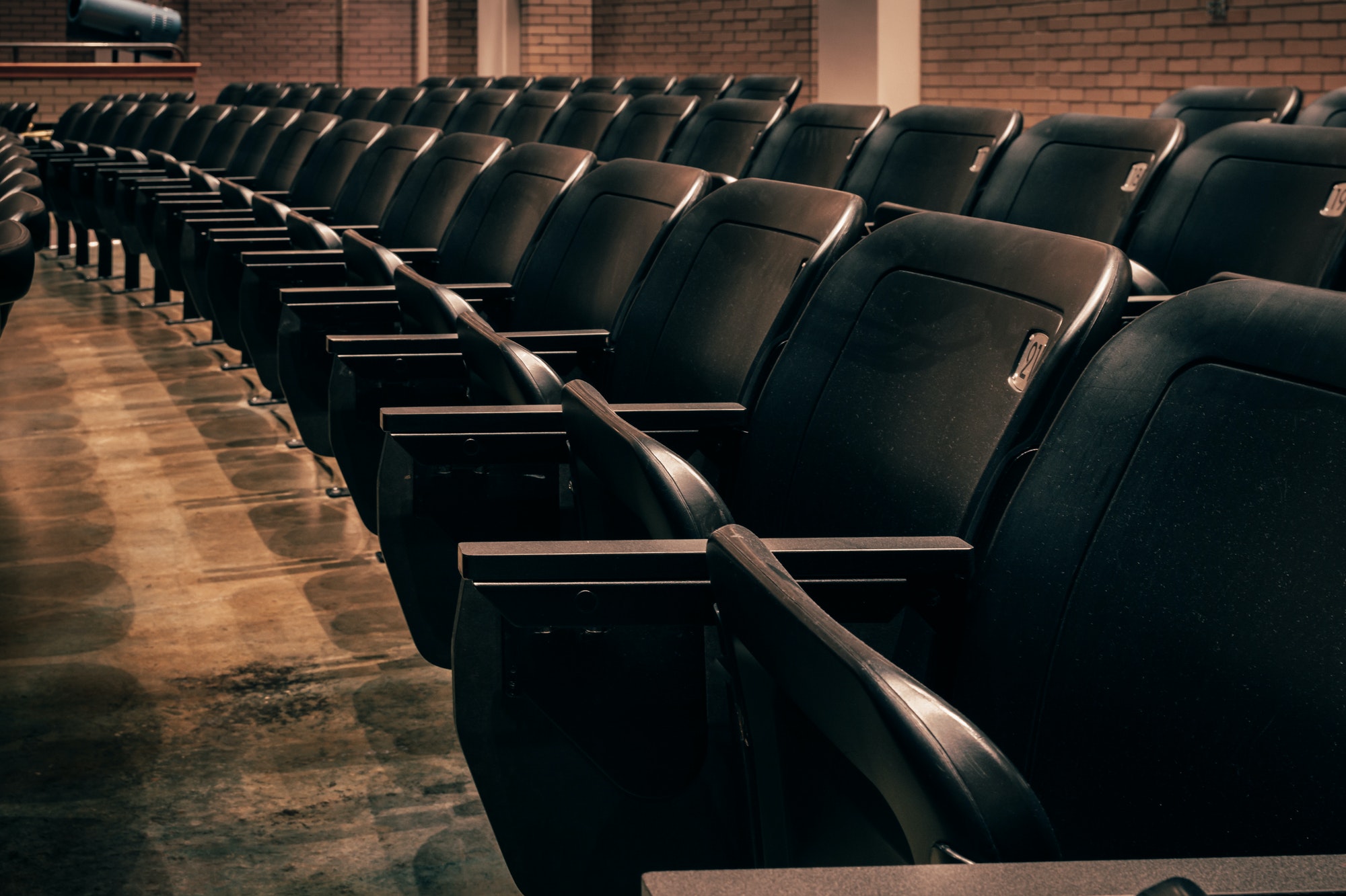 Numbered seats in an empty theatre (theater).
